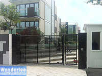 Slide gate with steel frame and wood infill
