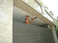 Repairing garage door at Constellation Cove